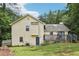 Exterior shot of the home featuring a backyard and deck at 309 Carmen Ct, Lawrenceville, GA 30046