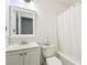 Bathroom featuring a combined tub and shower and a standard toilet at 309 Carmen Ct, Lawrenceville, GA 30046
