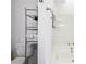 Simple bathroom featuring white tiled tub/shower and standard toilet at 309 Carmen Ct, Lawrenceville, GA 30046