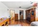 Bedroom space featuring wood flooring and a standard closet at 309 Carmen Ct, Lawrenceville, GA 30046