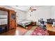 Bedroom featuring a wood floor, a ceiling fan, and basic furnishings at 309 Carmen Ct, Lawrenceville, GA 30046