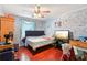 Bedroom featuring a standard ceiling fan and wood flooring at 309 Carmen Ct, Lawrenceville, GA 30046