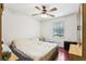 Standard bedroom featuring hardwood flooring and a ceiling fan at 309 Carmen Ct, Lawrenceville, GA 30046