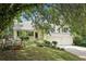 Charming home featuring a well-manicured lawn, lush landscaping, and a two-car garage at 309 Carmen Ct, Lawrenceville, GA 30046