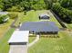Charming brick home featuring a carport and a spacious, fully fenced yard with an outbuilding and playhouse at 3872 Francis Dr, Powder Springs, GA 30127