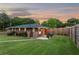 Spacious backyard featuring wooden fence and ambient string lighting at 3872 Francis Dr, Powder Springs, GA 30127