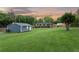 Spacious backyard featuring a detached garage and large lawn at 3872 Francis Dr, Powder Springs, GA 30127
