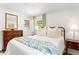 Charming bedroom with stylish decor, comfortable white bedding, and an ensuite bathroom at 3872 Francis Dr, Powder Springs, GA 30127