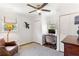 Comfortable bedroom featuring a ceiling fan, dual windows, and a cozy armchair at 3872 Francis Dr, Powder Springs, GA 30127