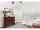 Bright bedroom with hardwood floors, ceiling fan, dresser, stylish decor, and freshly painted trim at 3872 Francis Dr, Powder Springs, GA 30127