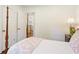 Cozy bedroom with wood floors, four-poster bed and access to a kitchen at 3872 Francis Dr, Powder Springs, GA 30127