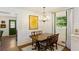 Dining area with traditional table and chairs, chandelier, and view of the yard at 3872 Francis Dr, Powder Springs, GA 30127