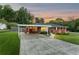 Lovely brick home featuring attached carport and manicured landscaping at 3872 Francis Dr, Powder Springs, GA 30127