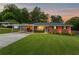 Charming single story brick home featuring a large front yard, driveway, and covered parking at 3872 Francis Dr, Powder Springs, GA 30127
