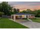 Attractive brick home with attached carport and neatly landscaped front yard at 3872 Francis Dr, Powder Springs, GA 30127