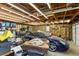 Spacious garage with exposed beams, storage, and parking for your car at 3872 Francis Dr, Powder Springs, GA 30127