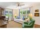 Bright living room with large windows, comfortable seating, and classic decor at 3872 Francis Dr, Powder Springs, GA 30127