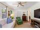 Comfortable living room with a sofa, armchair, and view into dining area at 3872 Francis Dr, Powder Springs, GA 30127