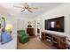 Living room featuring a flatscreen TV, wood floors, and classic furniture at 3872 Francis Dr, Powder Springs, GA 30127