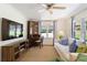 Cozy living room with neutral tones, a ceiling fan, and natural light at 3872 Francis Dr, Powder Springs, GA 30127