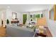 Elegant living room with hardwood floors, detailed molding, and a green entry door at 3872 Francis Dr, Powder Springs, GA 30127