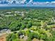 Picturesque aerial neighborhood shot with lush greenery and residences, showcasing the area's landscape at 399 Chestnut St, Social Circle, GA 30025