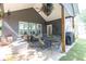 Inviting covered back porch with an outdoor dining area and lounge seating for relaxation at 399 Chestnut St, Social Circle, GA 30025