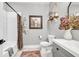 Well-lit bathroom features a shower-tub combo with white subway tile and elegant decor at 399 Chestnut St, Social Circle, GA 30025