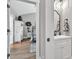 Bathroom with wood floors, undermount sink, and view to bedroom at 399 Chestnut St, Social Circle, GA 30025