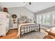 Comfortable bedroom retreat featuring natural light, neutral colors, and stylish furnishings at 399 Chestnut St, Social Circle, GA 30025