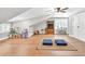 Bright bonus room with wood floors, tv area, white trim, and plenty of space at 399 Chestnut St, Social Circle, GA 30025