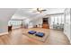 Spacious bonus room with hardwood floors, and a tv area; perfect for entertaining or relaxing at 399 Chestnut St, Social Circle, GA 30025
