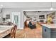 Bright, open floor plan showcasing dining area with hardwood floors flowing into the adjacent living area at 399 Chestnut St, Social Circle, GA 30025