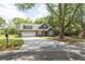 Attractive home with a well-maintained lawn, two-car garage, and a quaint front porch at 399 Chestnut St, Social Circle, GA 30025