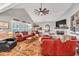 Spacious living room with vaulted ceiling, fireplace, plantation shutters, and comfortable seating arrangement at 399 Chestnut St, Social Circle, GA 30025