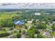 Aerial view of the Loganville, GA neighborhood with highlighted roads, green trees, and a photo of the house at 3135 Castlewood Dr, Loganville, GA 30052