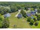 Aerial view showcasing the home's large lot, fenced backyard, mature trees, and neighborhood setting at 3135 Castlewood Dr, Loganville, GA 30052