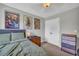 This is a bedroom that features neutral walls and flooring as well as anime decorations and a closet at 3135 Castlewood Dr, Loganville, GA 30052