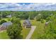 Sprawling property with a two-story brick home, large yard, and mature trees at 3135 Castlewood Dr, Loganville, GA 30052