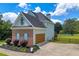 Two-story home with attached garage and a spacious backyard at 3135 Castlewood Dr, Loganville, GA 30052