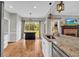 Kitchen with white cabinets, granite countertops, stainless steel appliances and a kitchen island at 3135 Castlewood Dr, Loganville, GA 30052