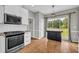 Kitchen featuring white cabinets, granite countertops, stainless steel appliances, and hardwood floors at 3135 Castlewood Dr, Loganville, GA 30052