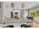 Kitchen featuring white cabinets, granite countertops, wooden floors, and stainless steel appliances at 3135 Castlewood Dr, Loganville, GA 30052