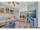 Bright living room featuring hardwood floors, a comfortable sofa, and a view of the dining area at 3135 Castlewood Dr, Loganville, GA 30052