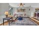 Cozy living room with neutral colors, hardwood floors, and a comfortable sofa, perfect for relaxation at 3135 Castlewood Dr, Loganville, GA 30052