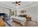 Main bedroom with desk, workstation, and natural light at 3135 Castlewood Dr, Loganville, GA 30052