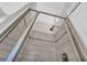 Beautiful shower with light stone-look tiling and glass door at 3135 Castlewood Dr, Loganville, GA 30052