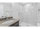 Sleek bathroom with modern fixtures, glass shower door, and stylish vanity at 4304 Lake Laurel Se Dr, Smyrna, GA 30082
