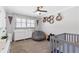 Bedroom with ample sunlight, a changing table, and ample space at 4304 Lake Laurel Se Dr, Smyrna, GA 30082