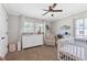 Bedroom with natural light, a rocking chair, and soft neutral tones at 4304 Lake Laurel Se Dr, Smyrna, GA 30082